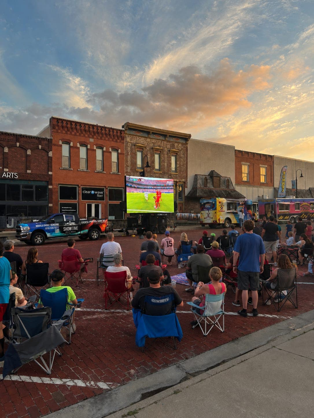 Crowd watching sports broadcast on a Showtime LED screen