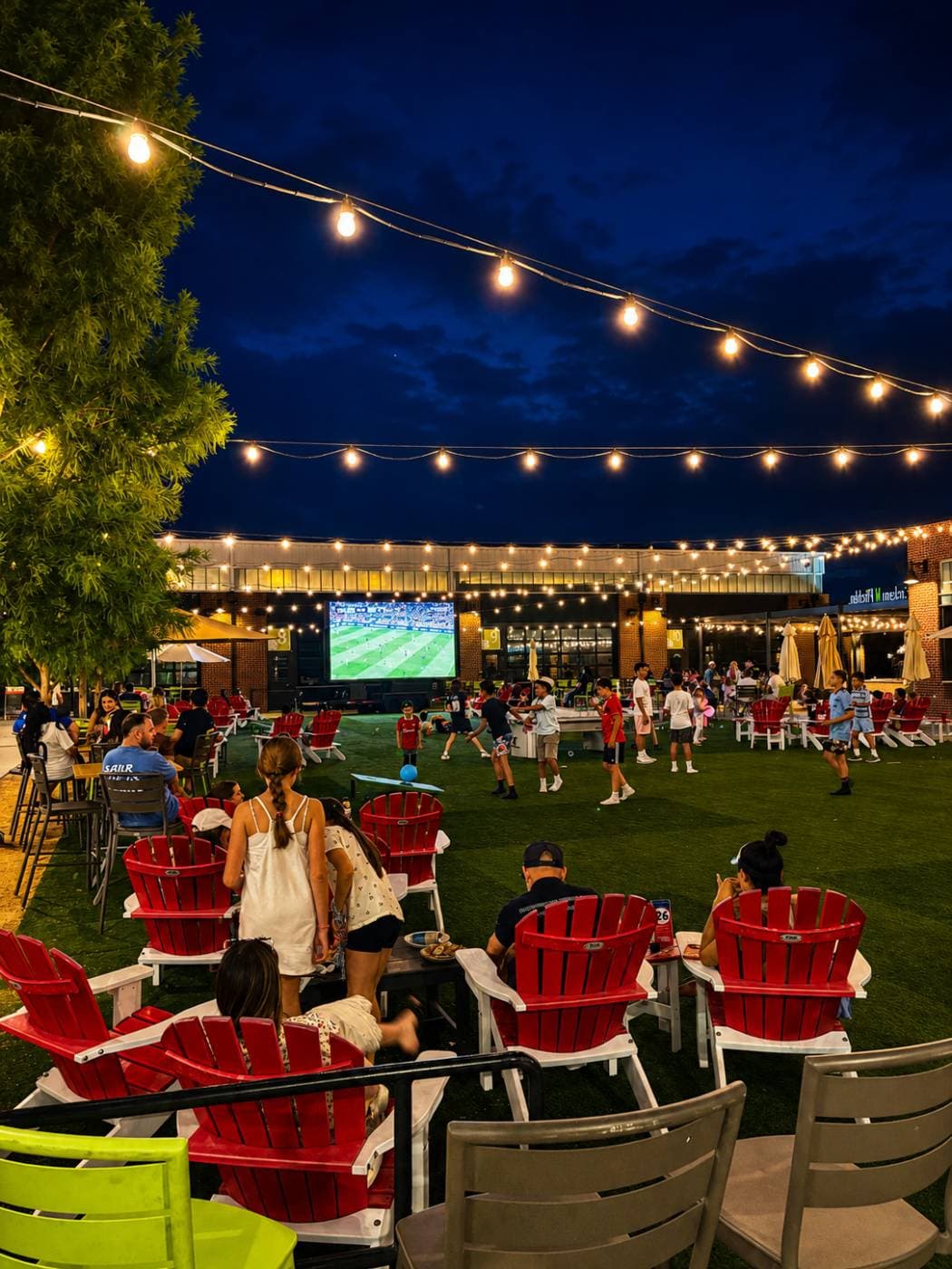 Showtime 12′ × 7′ mobile LED screen trailer raised for an outdoor evening event