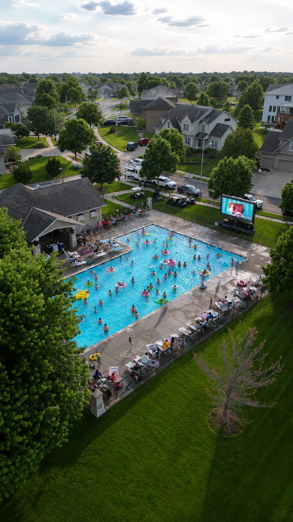 Aerial view of a neighborhood pool movie night on a Showtime screen