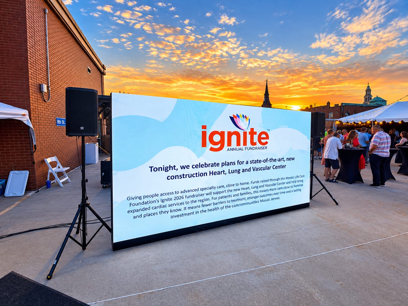 Showtime custom LED wall on a ground-supported base with speakers at an outdoor rooftop fundraiser