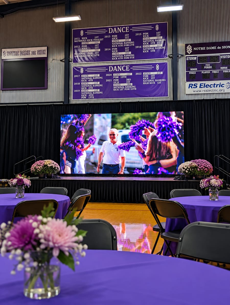 Showtime custom LED wall on a stage at an indoor school open house in a gym